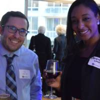 Two alumni smile for a photo together at the Chicago Reception